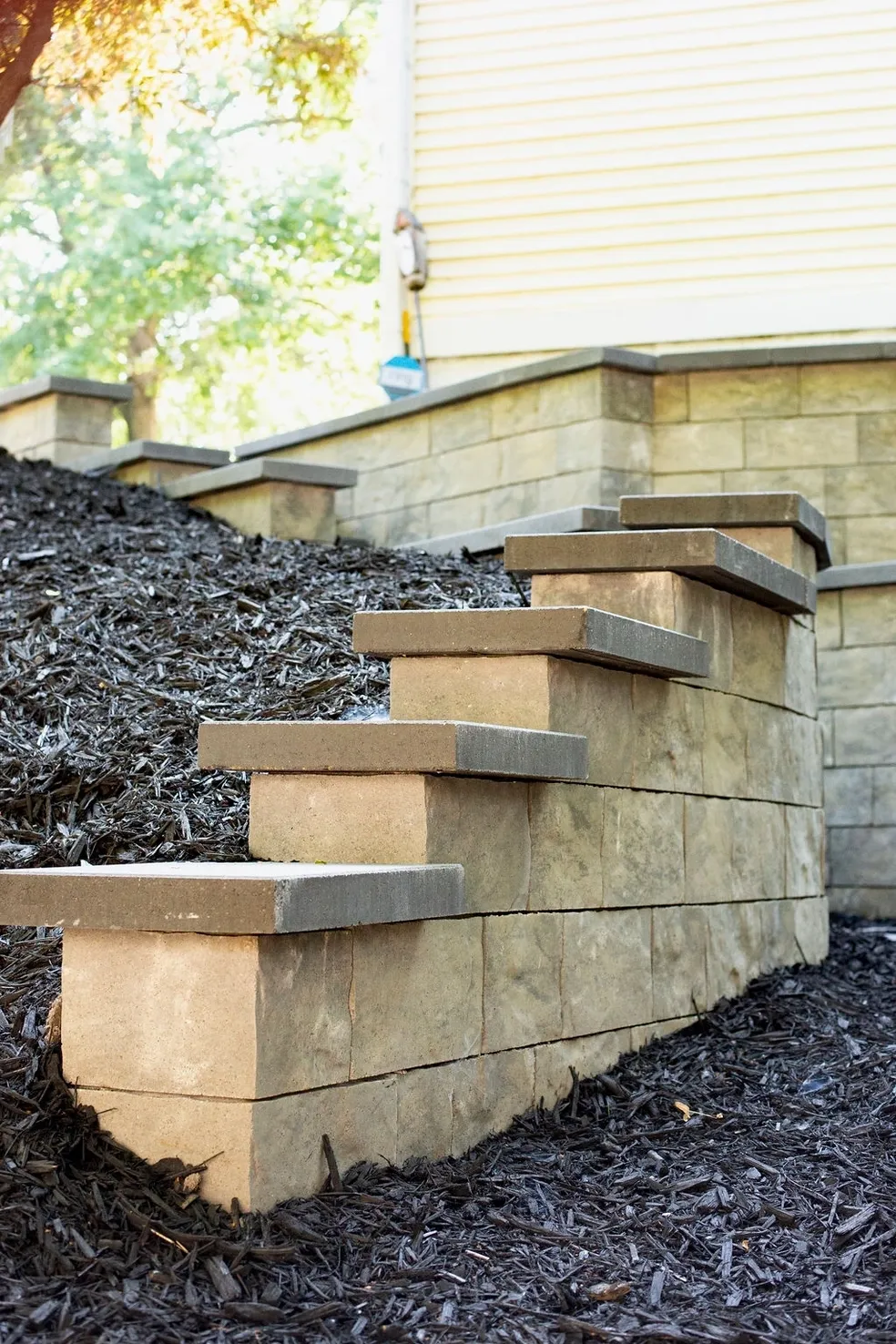 A set of steps leading up to the side of a house.