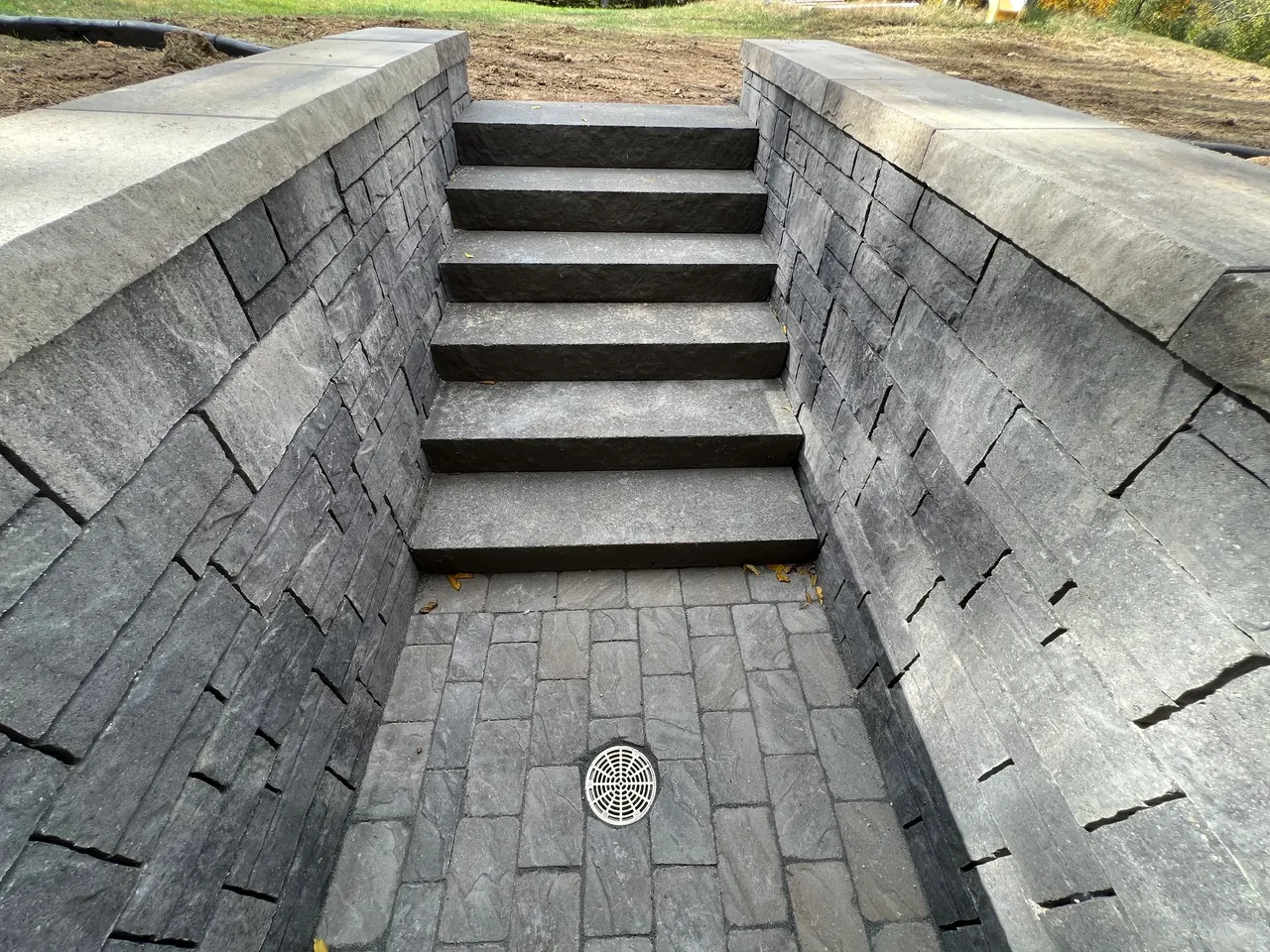 A walkway with steps leading to the top of it.