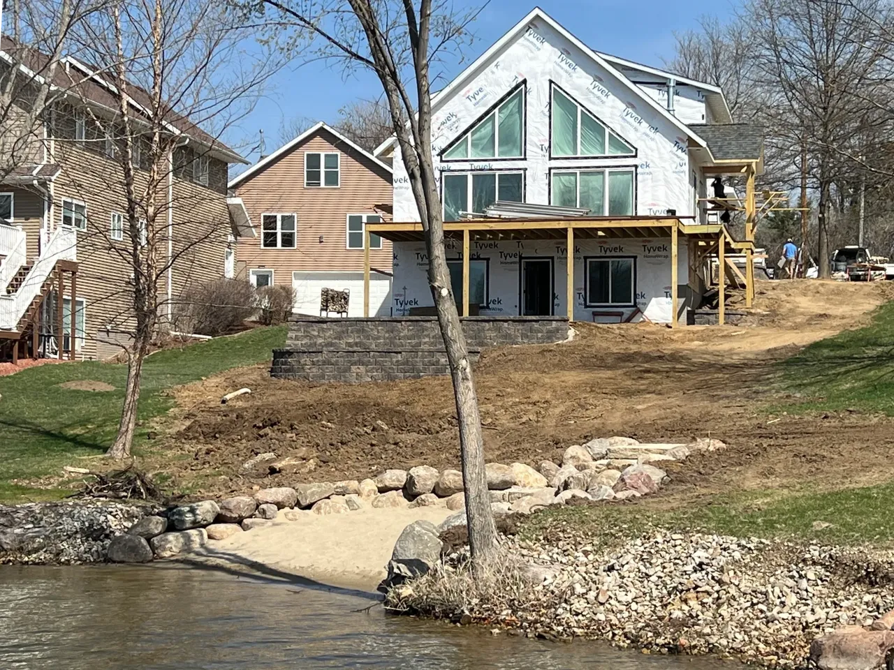 A house sitting on the side of a river.